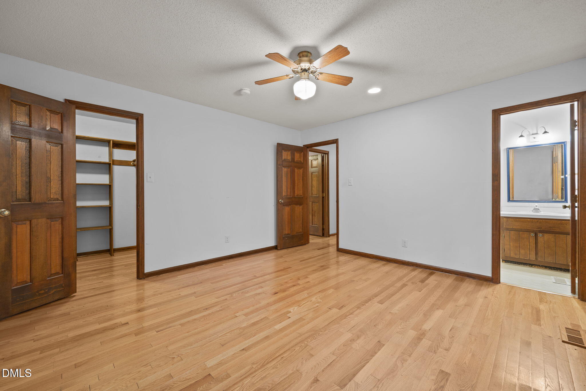 2713 Salisbury Plain Raleigh, NC 27613 - Photo 23 of 39 a view of an empty room with window and wooden floor