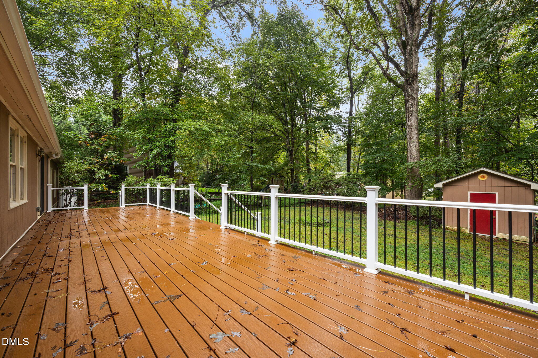 2713 Salisbury Plain Raleigh, NC 27613 - Photo 31 of 39 a view of a balcony with wooden floor and fence