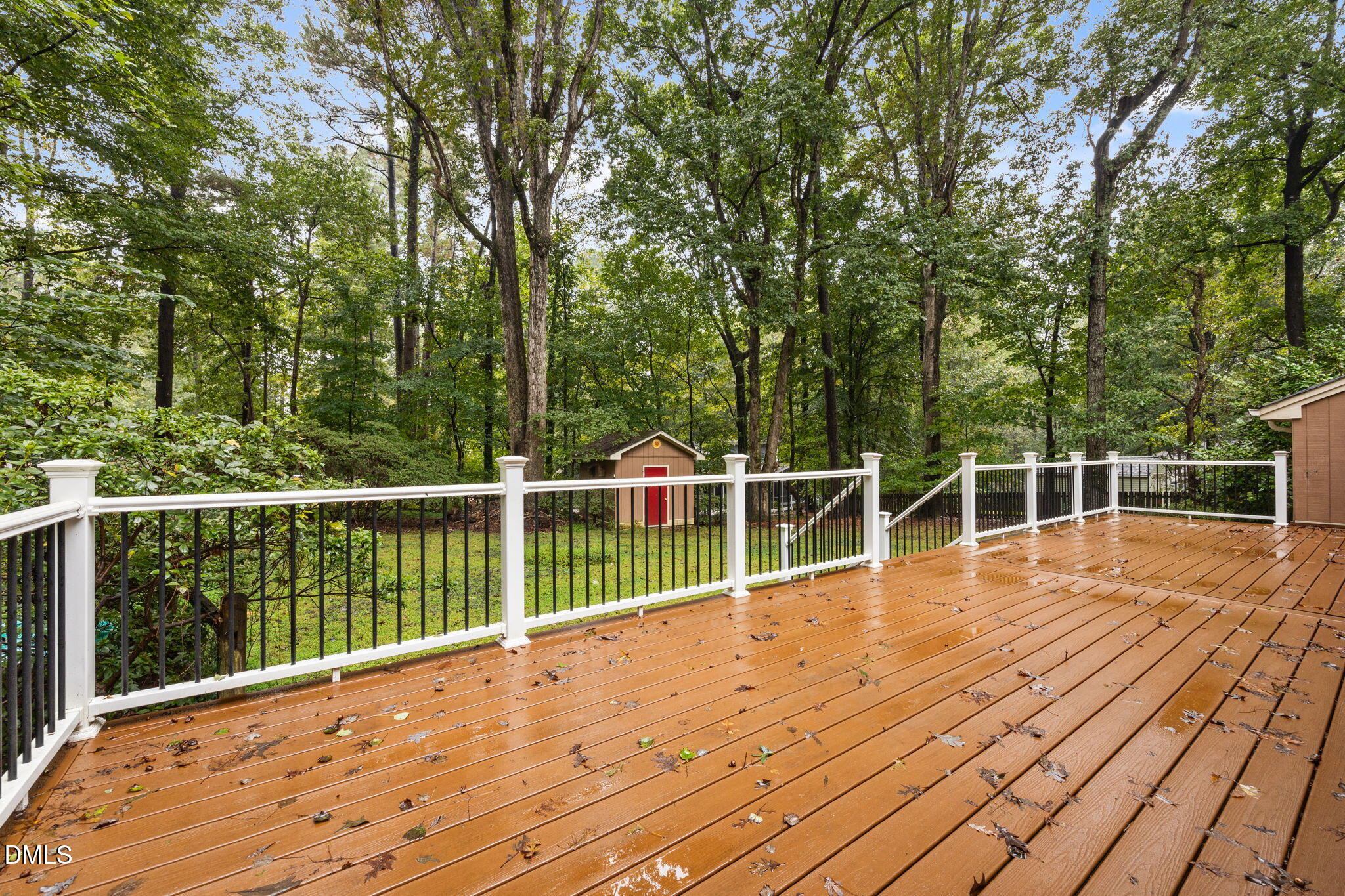 2713 Salisbury Plain Raleigh, NC 27613 - Photo 32 of 39 a view of a balcony with wooden floor and fence