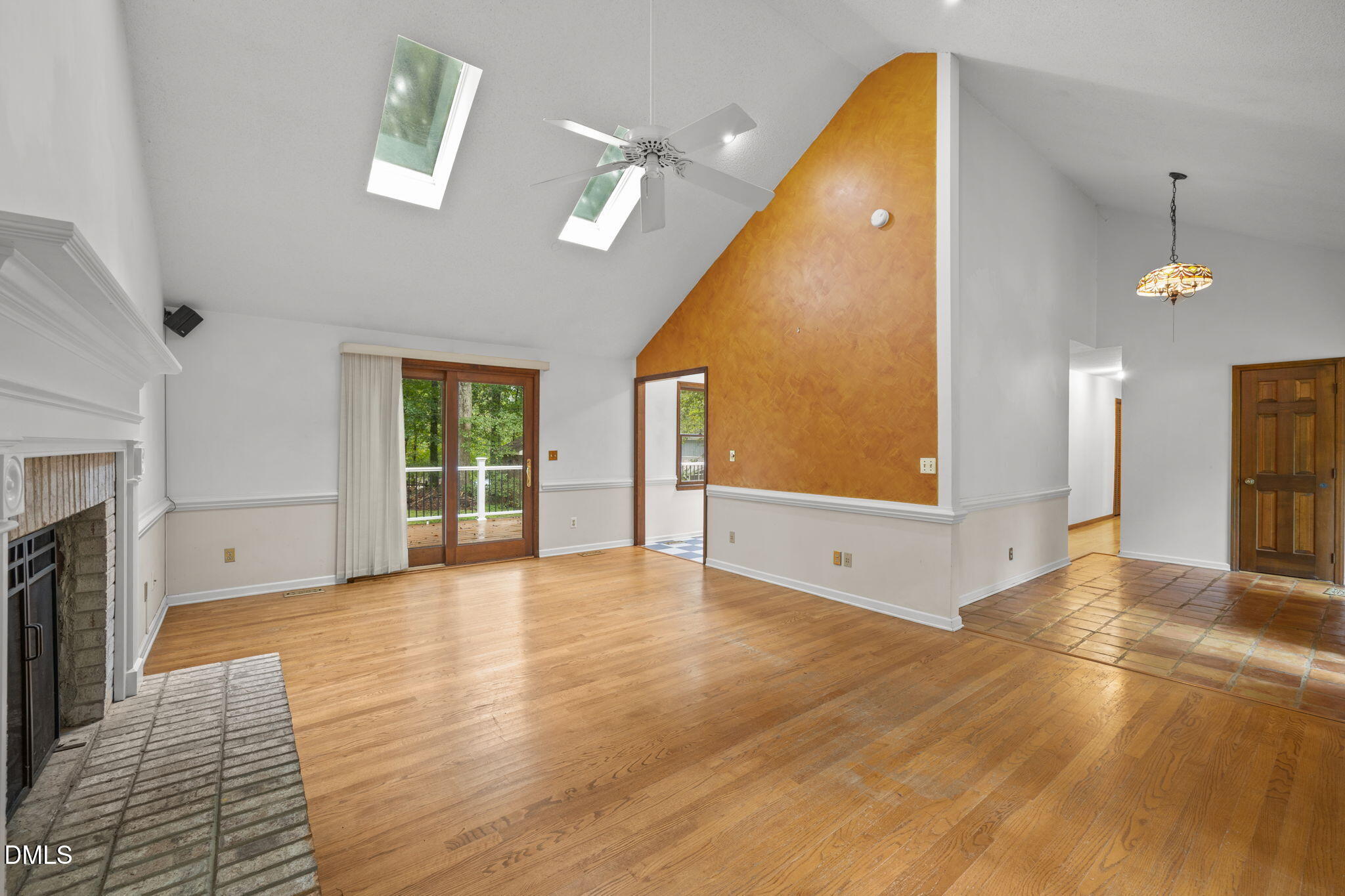 2713 Salisbury Plain Raleigh, NC 27613 - Photo 5 of 39 a view of an empty room with a fireplace and a window