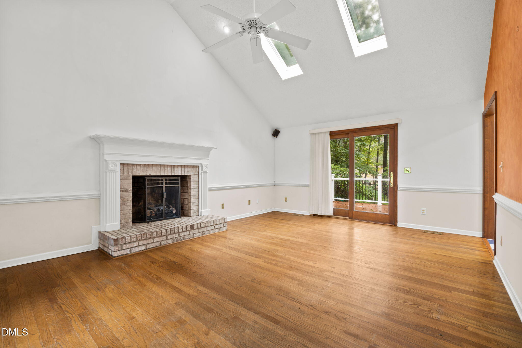 2713 Salisbury Plain Raleigh, NC 27613 - Photo 9 of 39 an empty room with windows fireplace and a sink