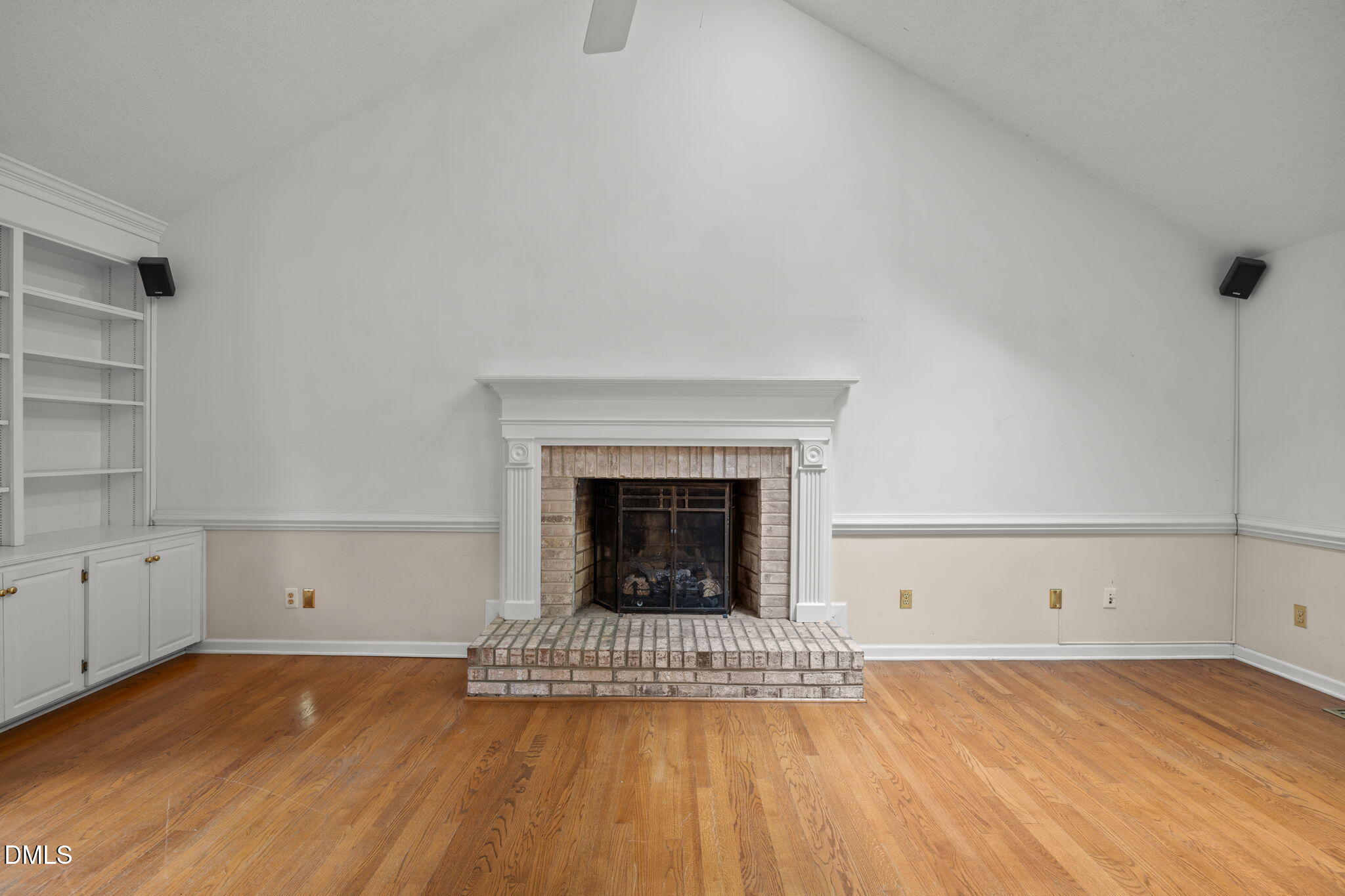 2713 Salisbury Plain Raleigh, NC 27613 - Photo 10 of 39 a view of empty room with wooden floor and fireplace