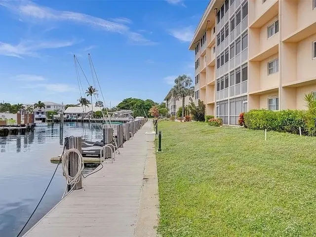 a view of a building with outdoor space and sitting area