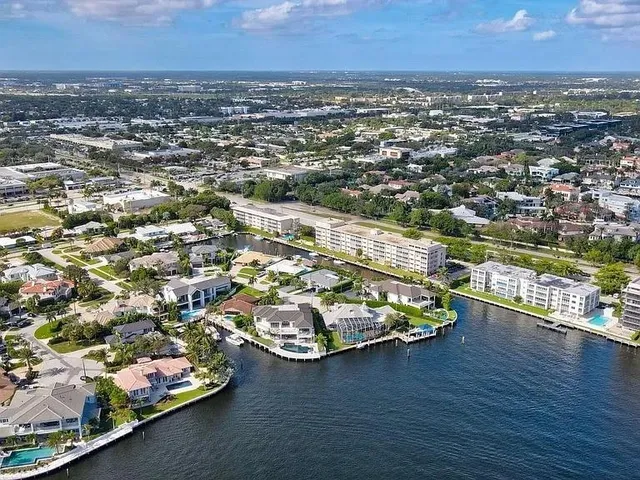 an aerial view of residential houses with outdoor space