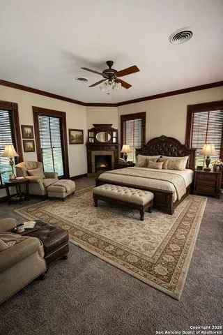 a bedroom with furniture and a chandelier