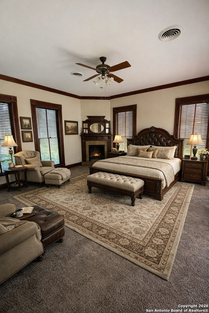 1111 Magnolia Street Uvalde, TX 78801 - Photo 15 of 34 a bedroom with furniture and a chandelier