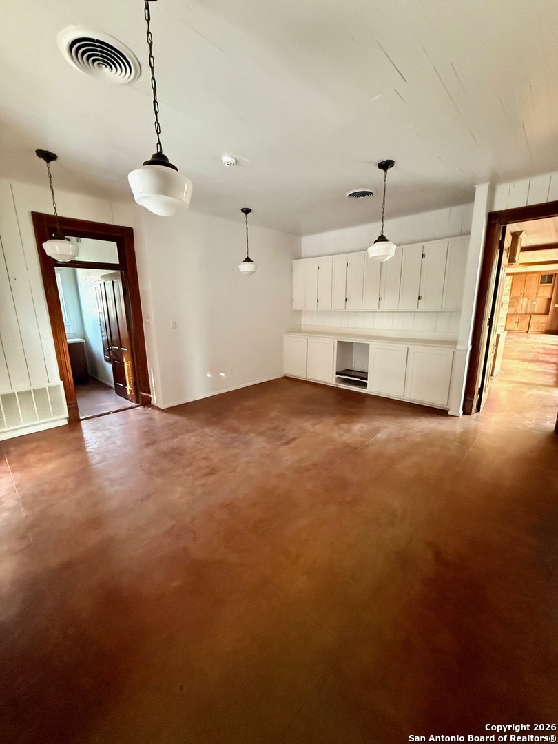 1111 Magnolia Street Uvalde, TX 78801 - Photo 16 of 34 a view of an empty room with a window