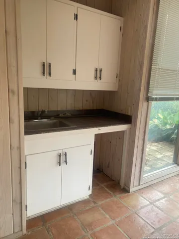 a view of cabinets and window