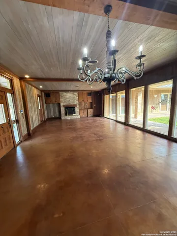 a view of a hall with a flat screen tv