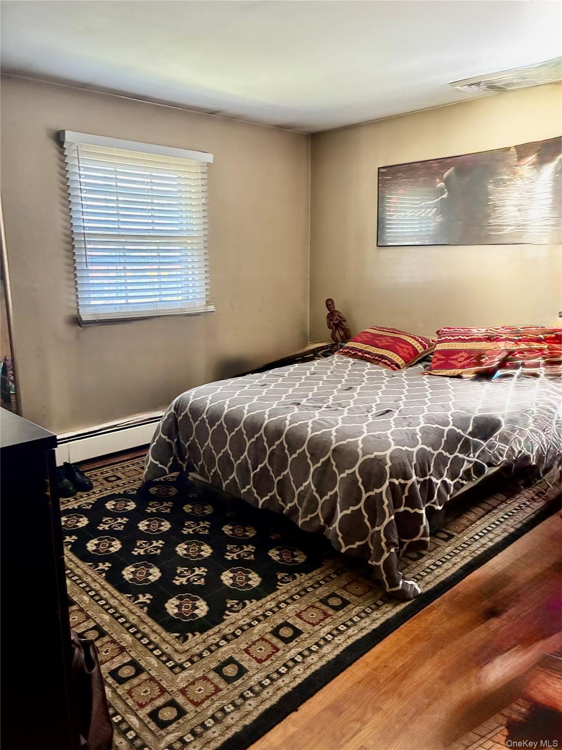 24 Ann Boulevard Spring Valley, NY 10977 - Photo 16 of 25 a bedroom with a bed