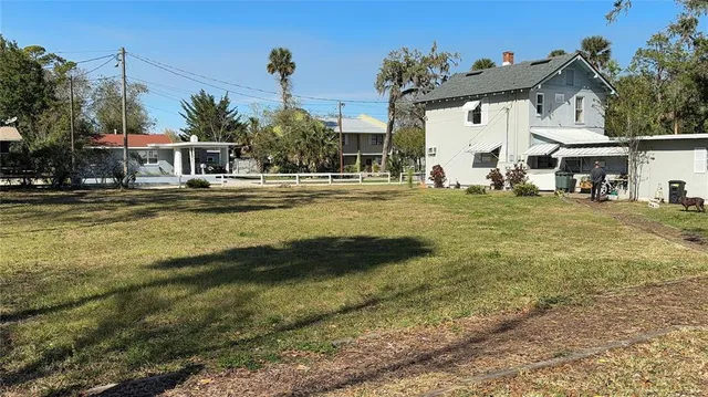 a view of wooden floor with entryway