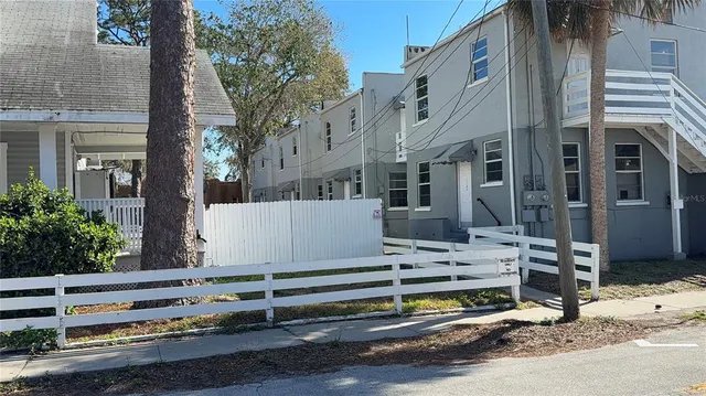 a view of a street with a building in the background