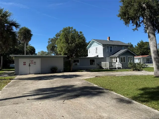 a view of house with yard