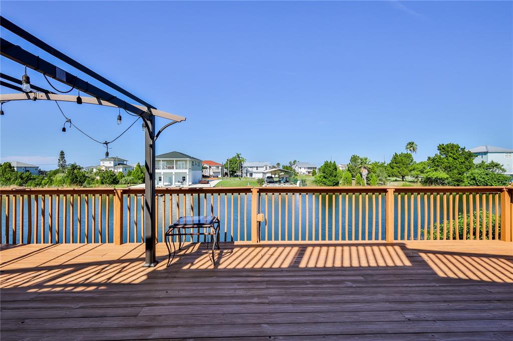 3397 Crape Myrtle Drive Hernando Beach, FL 34607 - Photo 12 of 76 a view of balcony with wooden floor and fence