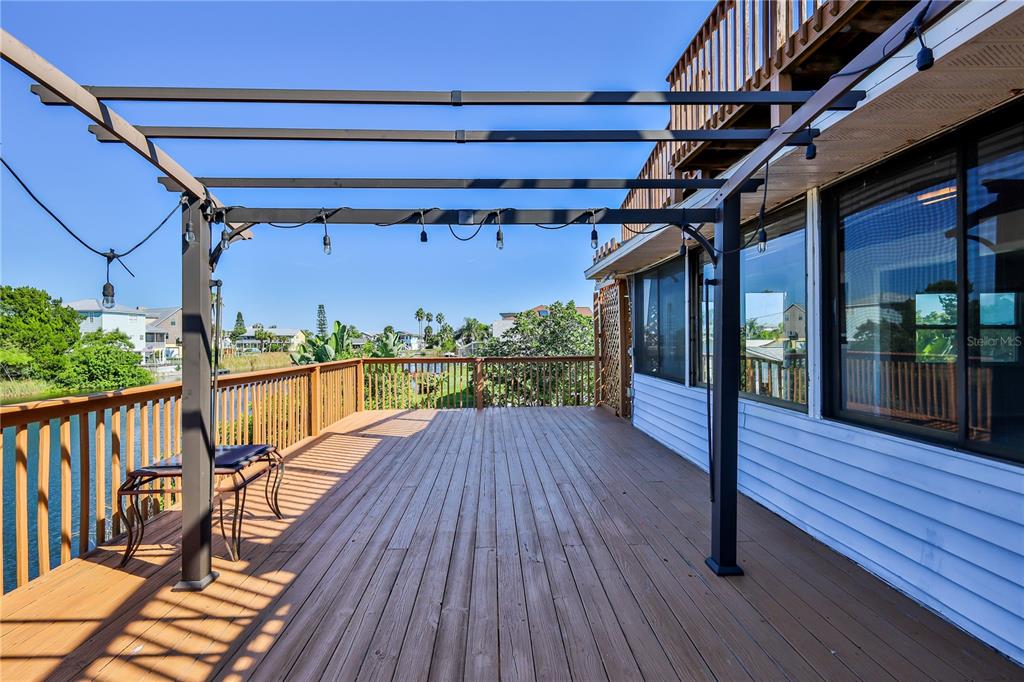 3397 Crape Myrtle Drive Hernando Beach, FL 34607 - Photo 13 of 76 a view of a balcony with wooden floor