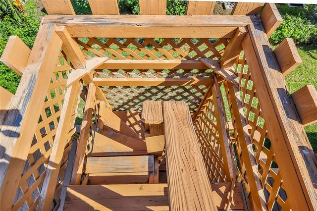 a kitchen with stainless steel appliances granite countertop a refrigerator a sink dishwasher a stove with wooden cabinets and floor