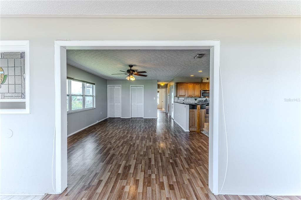 3397 Crape Myrtle Drive Hernando Beach, FL 34607 - Photo 31 of 76 a view of a hallway view with wooden floor and staircase