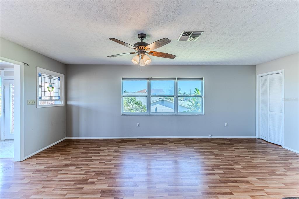 3397 Crape Myrtle Drive Hernando Beach, FL 34607 - Photo 33 of 76 wooden floor in an empty room with a window
