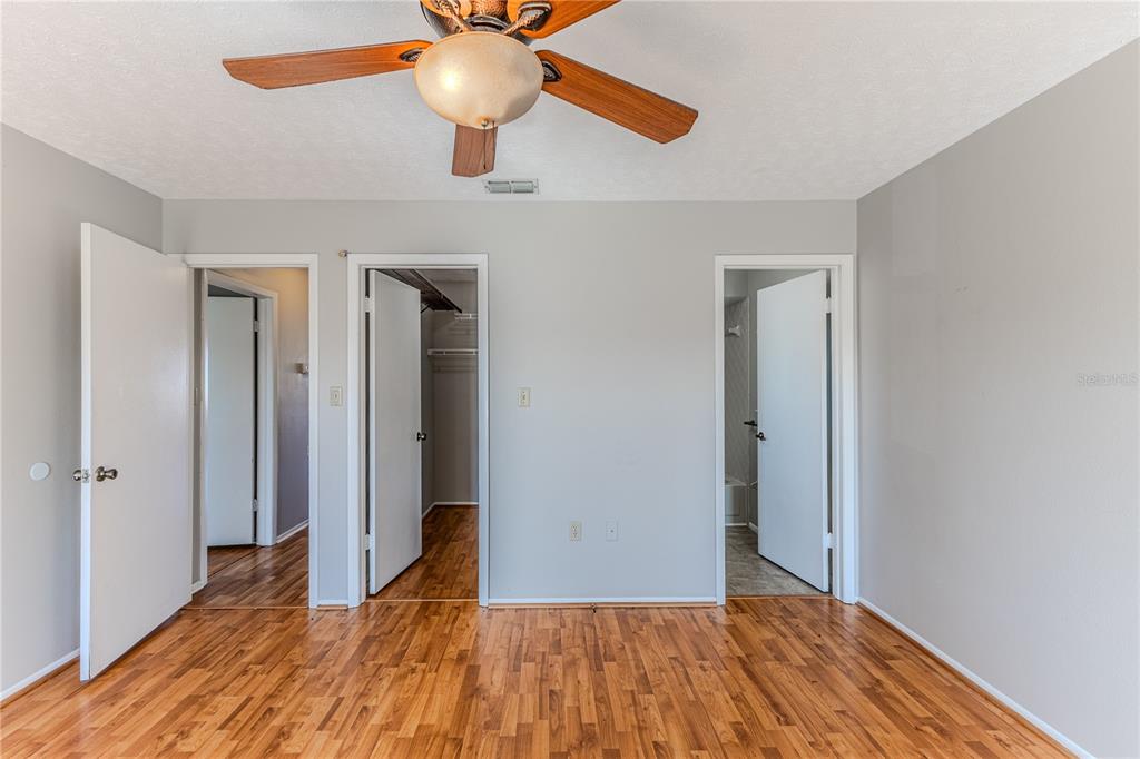 3397 Crape Myrtle Drive Hernando Beach, FL 34607 - Photo 53 of 76 wooden floor in an empty room with a window