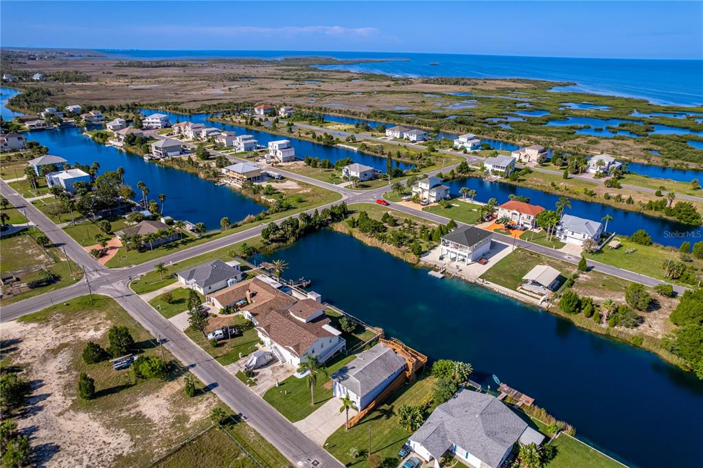 3397 Crape Myrtle Drive Hernando Beach, FL 34607 - Photo 61 of 76 an aerial view of residential houses with outdoor space