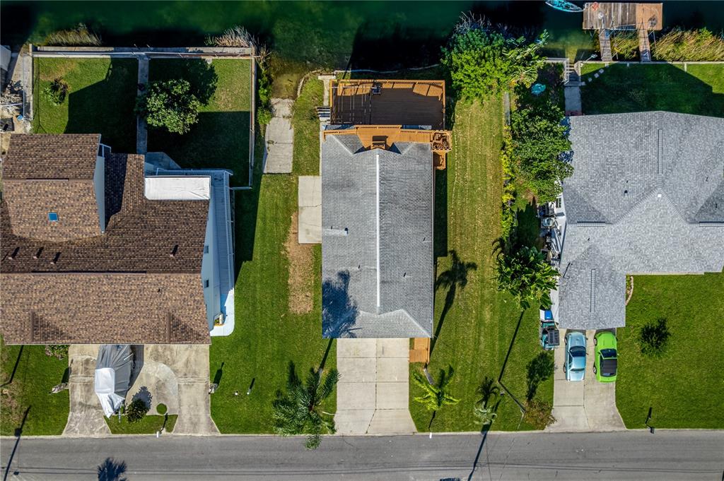 3397 Crape Myrtle Drive Hernando Beach, FL 34607 - Photo 67 of 76 an aerial view of a house with a garden