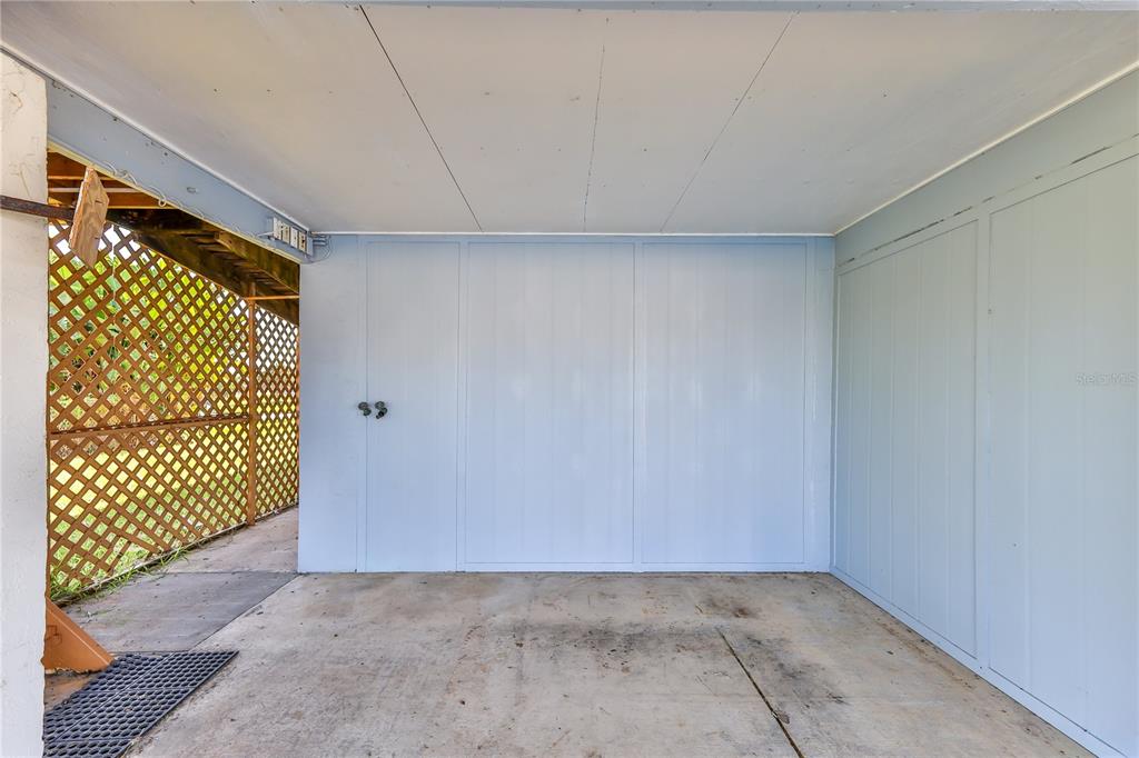 3397 Crape Myrtle Drive Hernando Beach, FL 34607 - Photo 70 of 76 an empty room with a wooden door and door