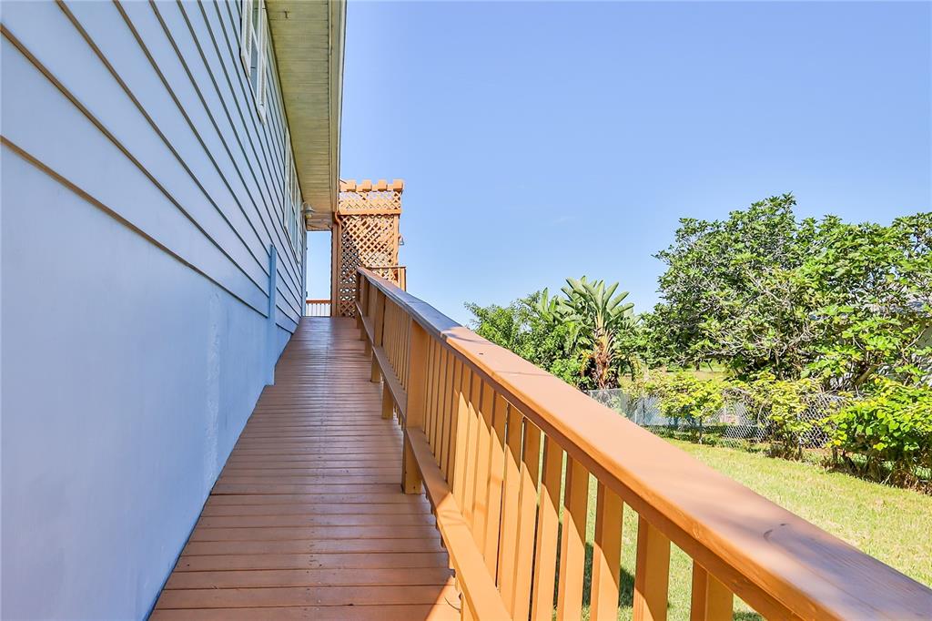 3397 Crape Myrtle Drive Hernando Beach, FL 34607 - Photo 8 of 76 a view of a balcony with wooden stairs