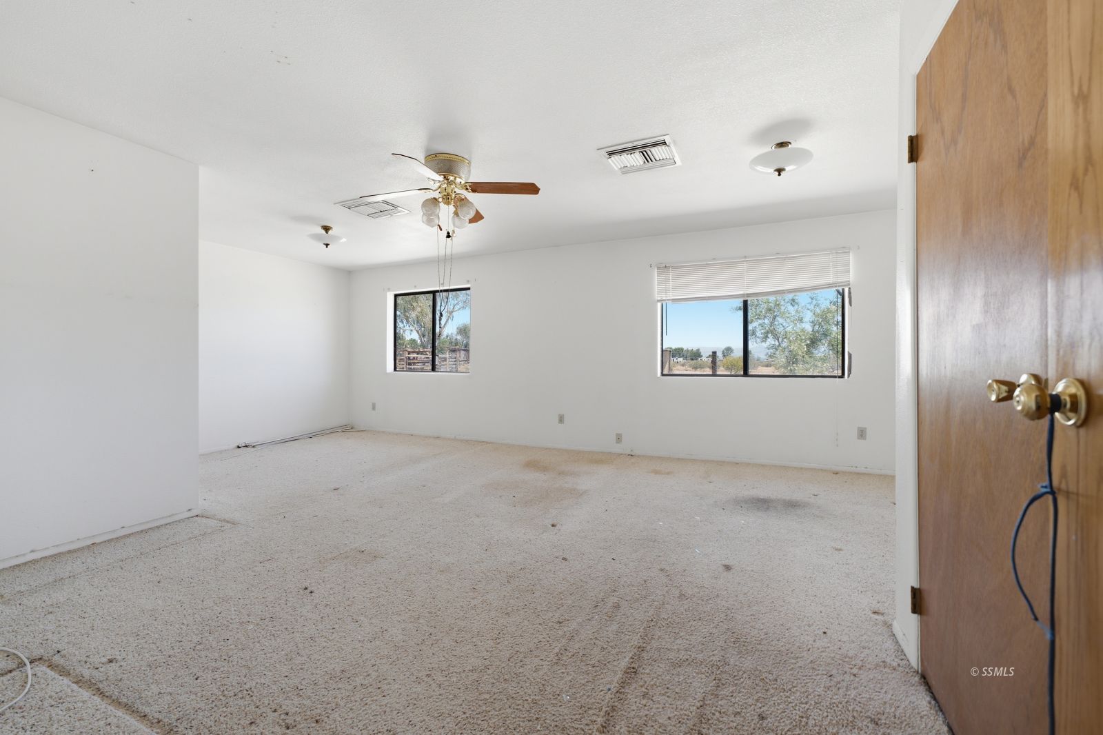 3443 3rd Street Inyokern, CA 93527 - Photo 10 of 24 an empty room with windows and a ceiling fan