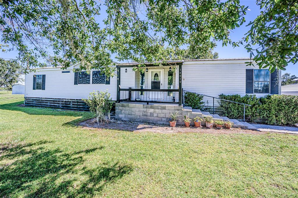 front view of a house with a big yard