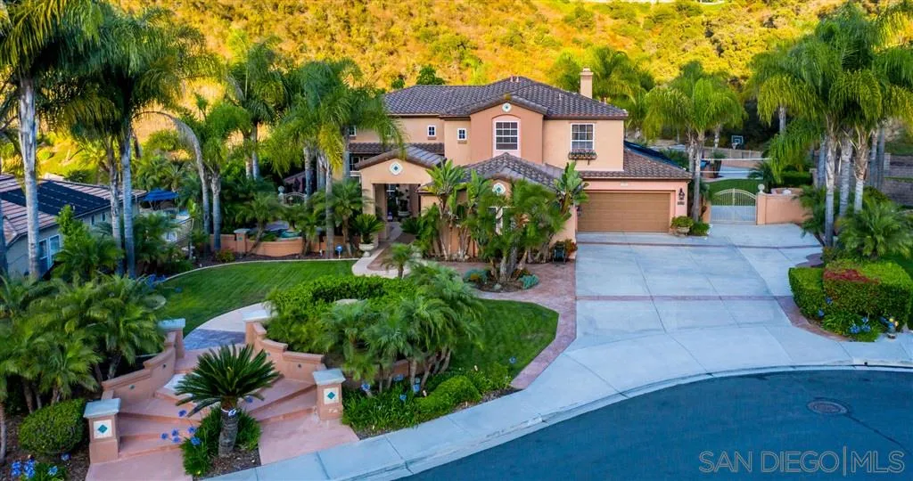 11683 Eastfield Road Poway, CA 92064 - Photo 1 of 21 a front view of a house with a yard and potted plants
