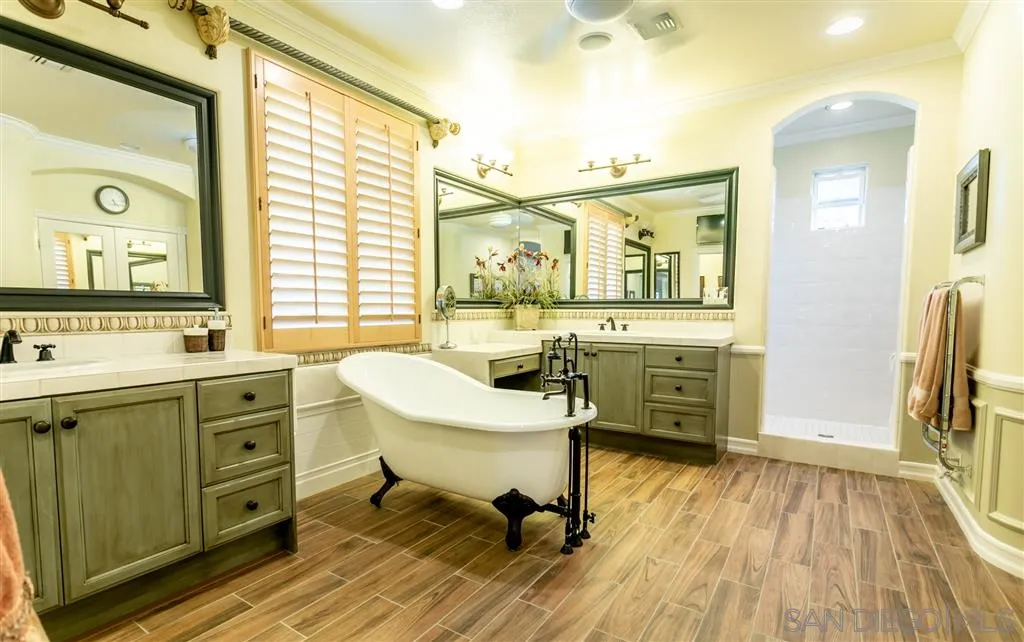 11683 Eastfield Road Poway, CA 92064 - Photo 11 of 21 a view of a bathroom with a sink mirror and a bathtub