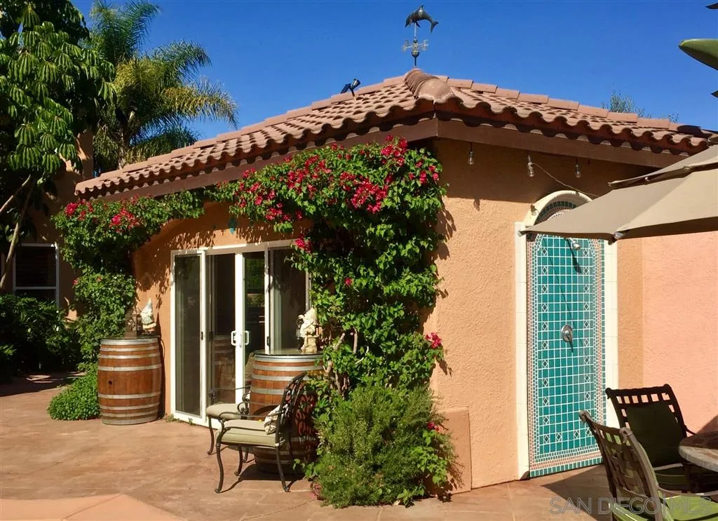 11683 Eastfield Road Poway, CA 92064 - Photo 15 of 21 a view of a patio with table and chairs and potted plants