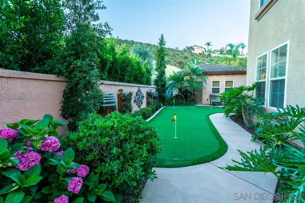 11683 Eastfield Road Poway, CA 92064 - Photo 19 of 21 a view of a house with a yard and potted plants