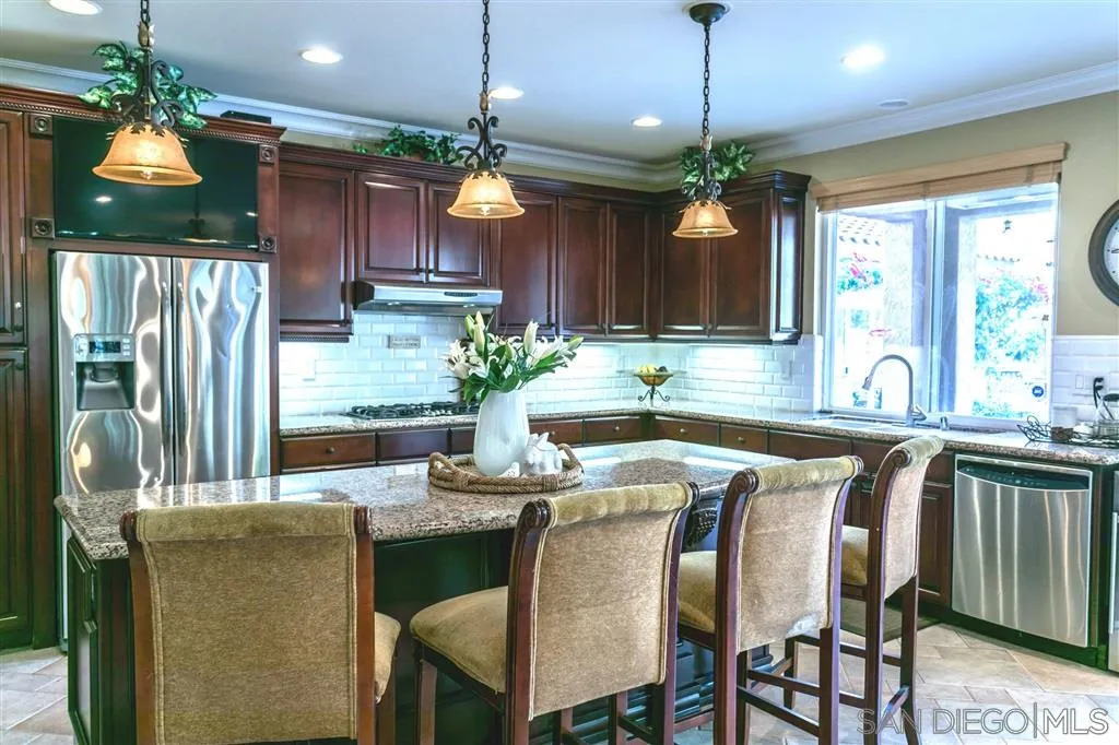 11683 Eastfield Road Poway, CA 92064 - Photo 5 of 21 a dining room with furniture a chandelier and window