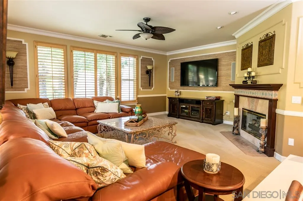 11683 Eastfield Road Poway, CA 92064 - Photo 8 of 21 a living room with furniture fireplace and flat screen tv