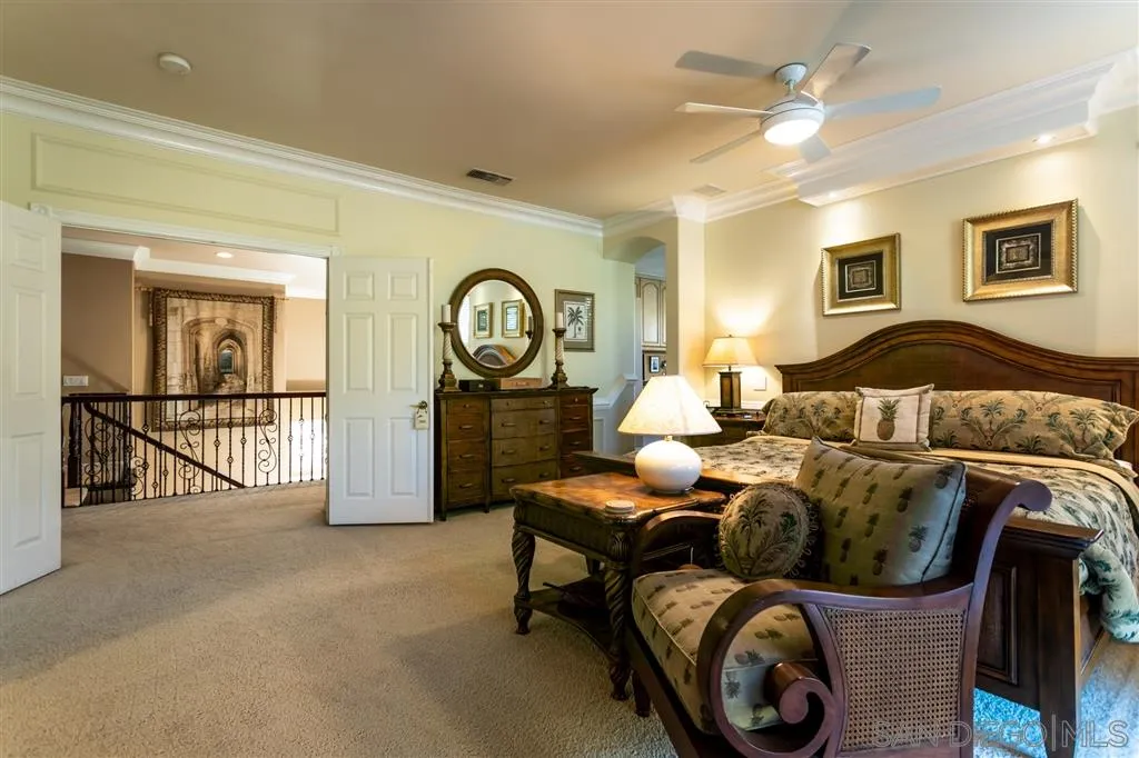 11683 Eastfield Road Poway, CA 92064 - Photo 10 of 21 a living room with furniture a clock and a window