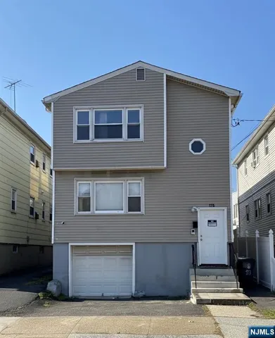 a front view of a house with stairs