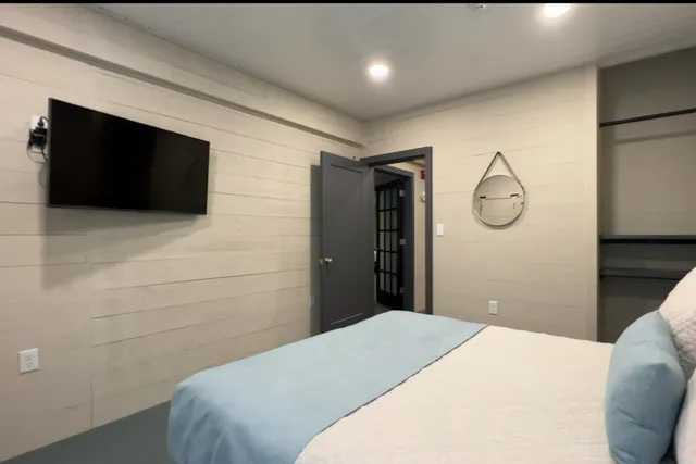 a bathroom with a sink mirror vanity and a toilet