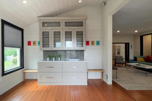a kitchen with counter top space sink and center island