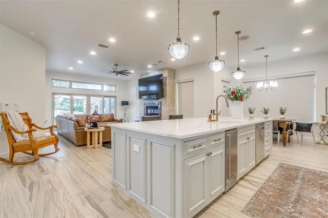 a large kitchen with lots of counter space and a sink