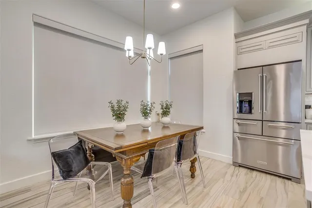 a bathroom with a granite countertop sink a mirror and a shower