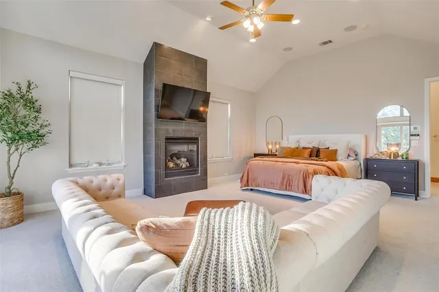 a bathroom with a granite countertop sink mirror and a shower