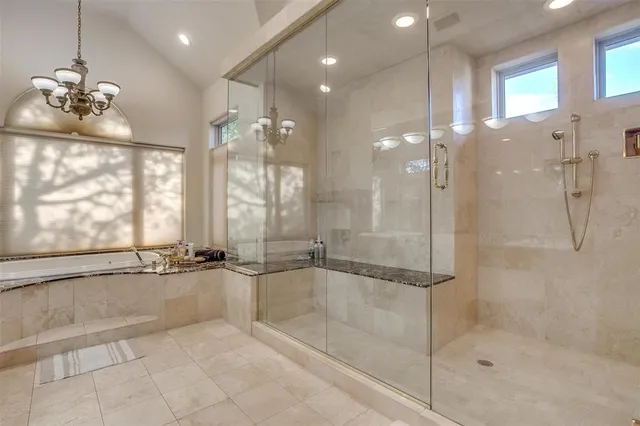 a bedroom with a bed and a potted plant