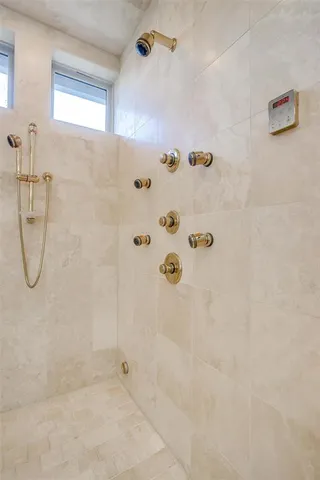 a bedroom with bed and a window