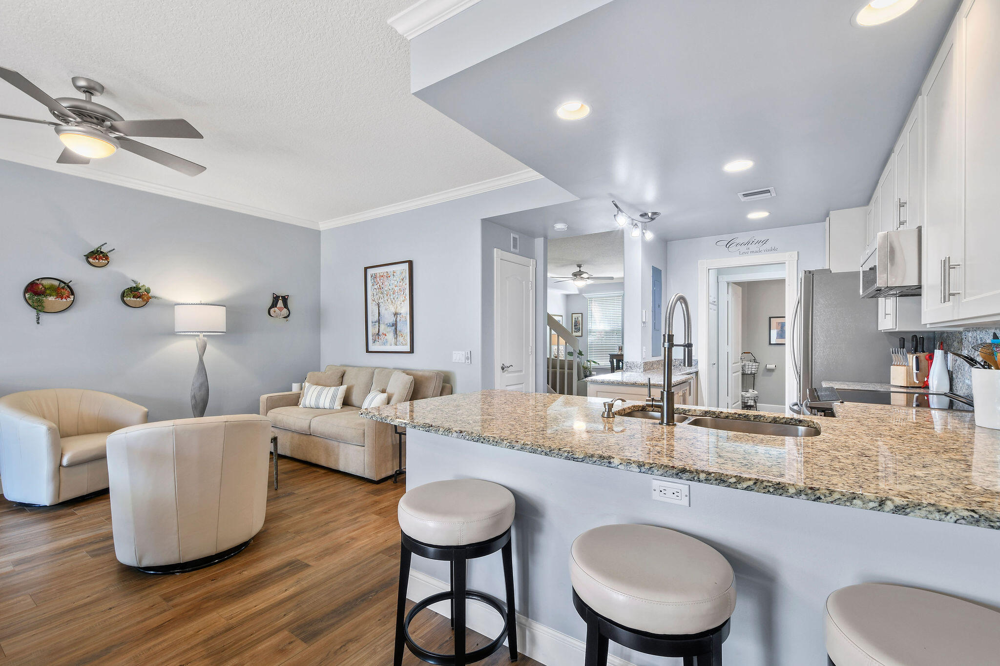 111 Ashley Court Jupiter, FL 33458 - Photo 13 of 68 a dining room with wooden floor and chandelier