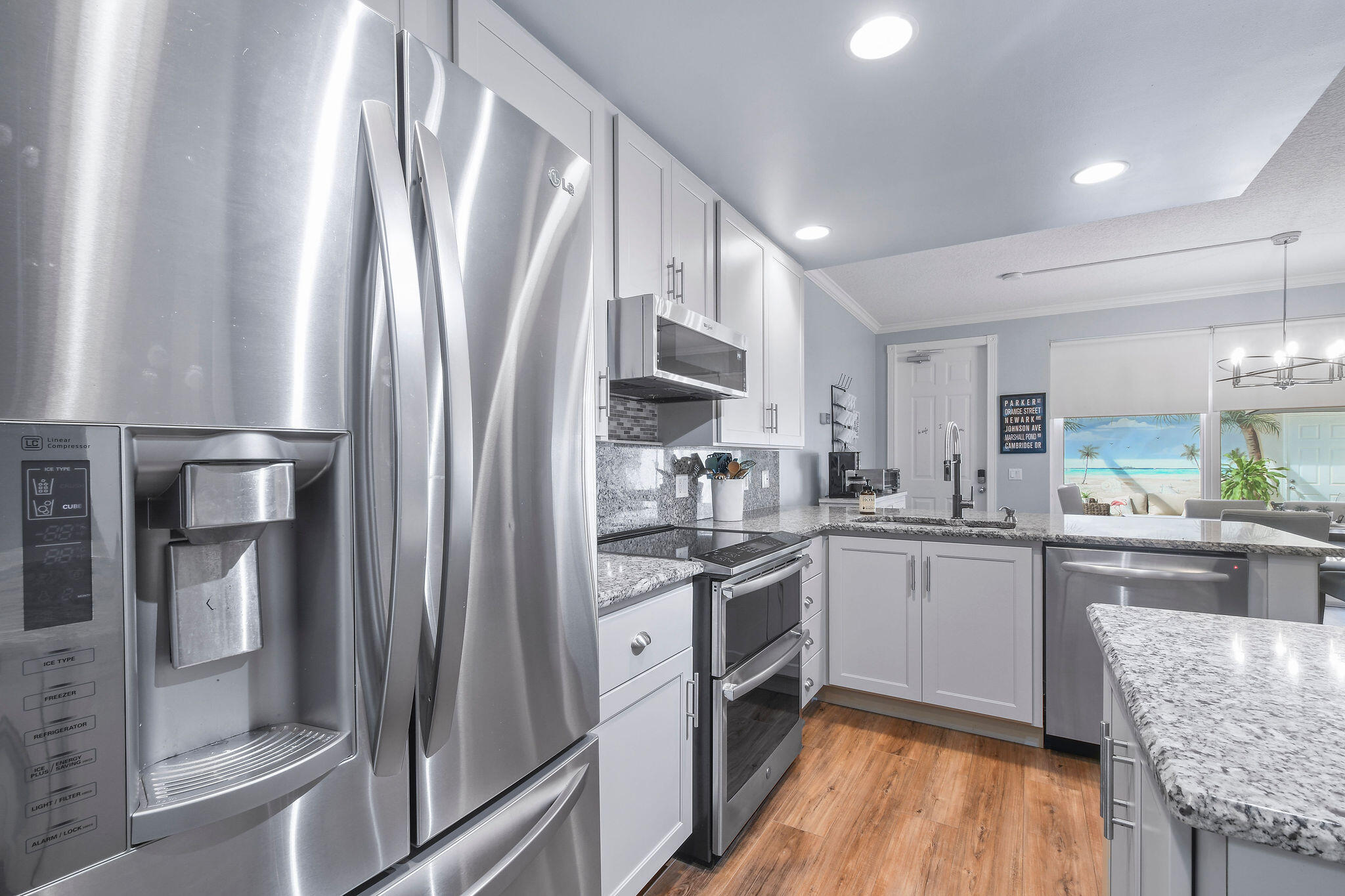 111 Ashley Court Jupiter, FL 33458 - Photo 15 of 68 a kitchen with stainless steel appliances granite countertop a refrigerator and a stove top oven