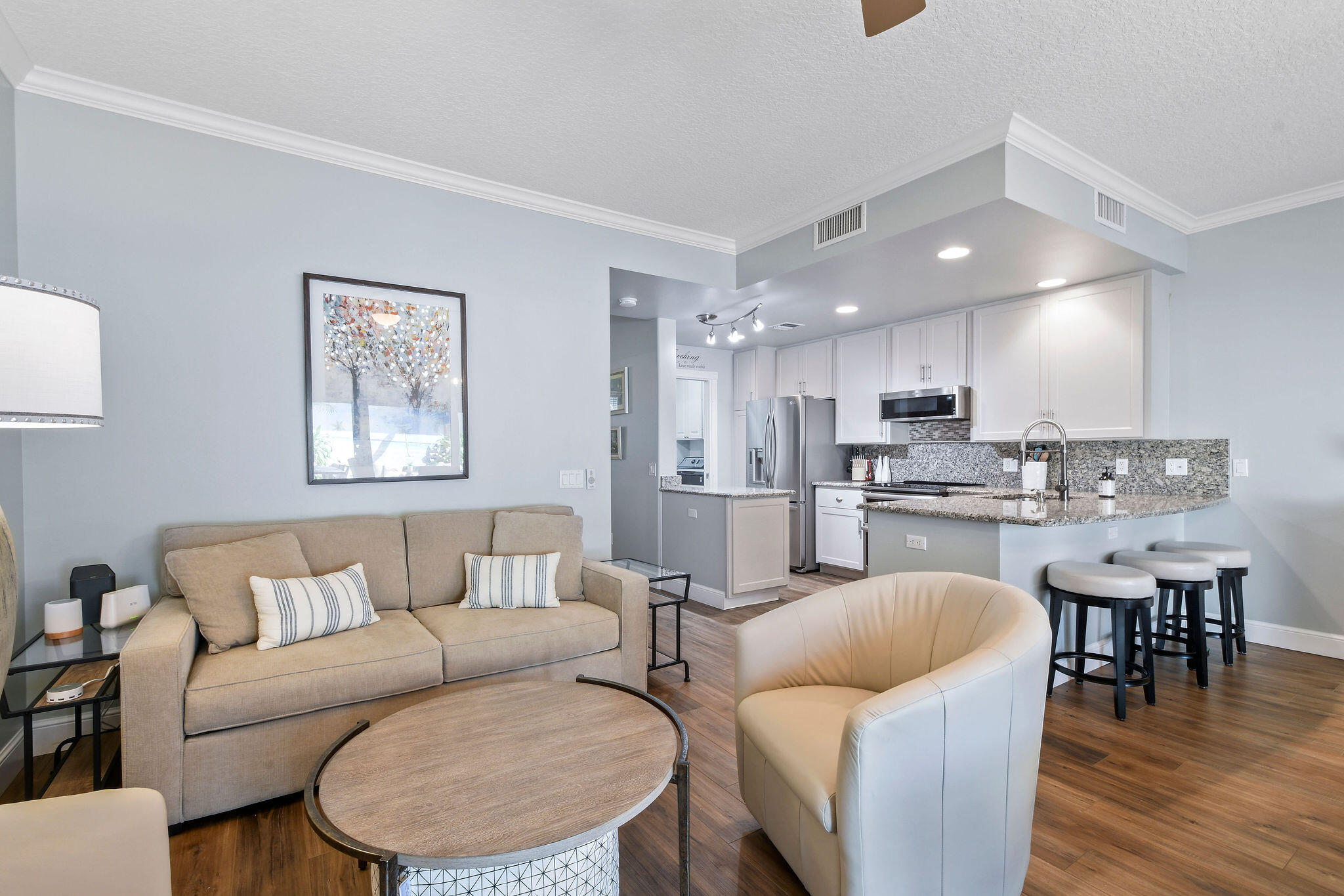 111 Ashley Court Jupiter, FL 33458 - Photo 18 of 68 a living room with furniture and kitchen view