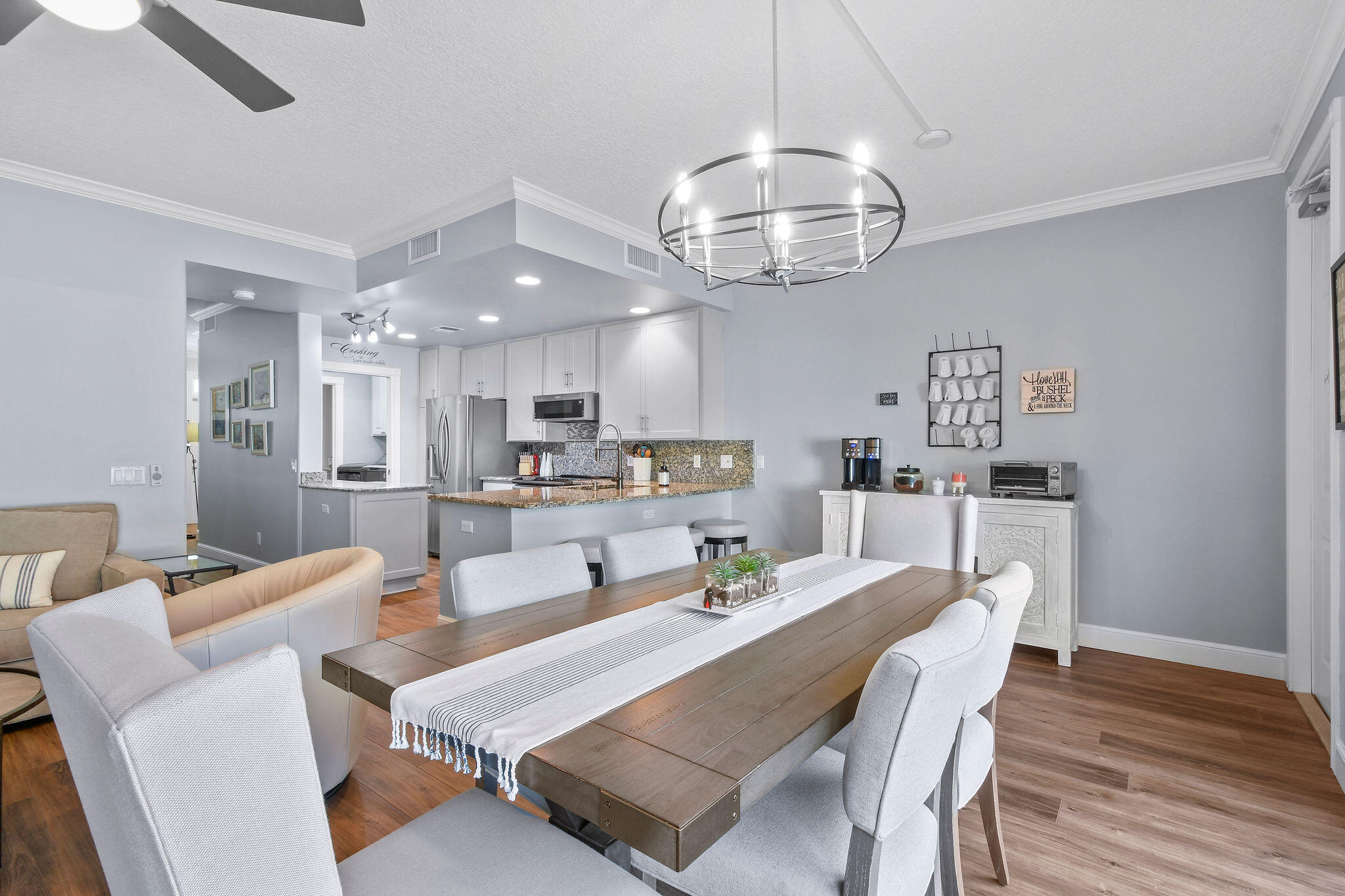 111 Ashley Court Jupiter, FL 33458 - Photo 21 of 68 a kitchen with a dining table and wooden floor
