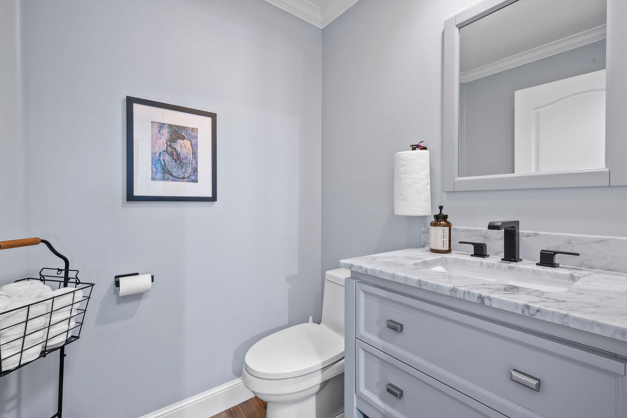 111 Ashley Court Jupiter, FL 33458 - Photo 24 of 68 a bathroom with a granite countertop toilet sink and mirror
