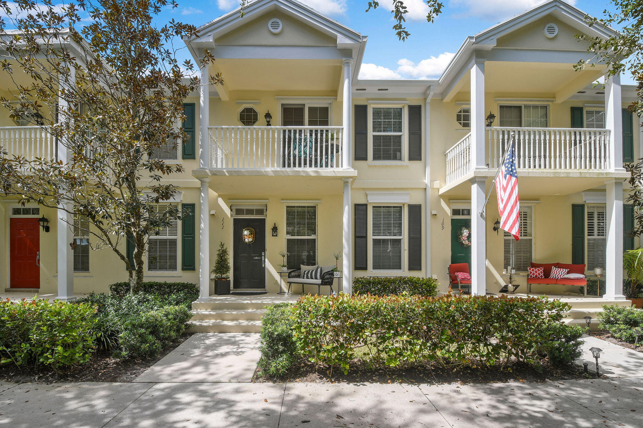 111 Ashley Court Jupiter, FL 33458 - Photo 3 of 68 front view of a brick house with a large windows